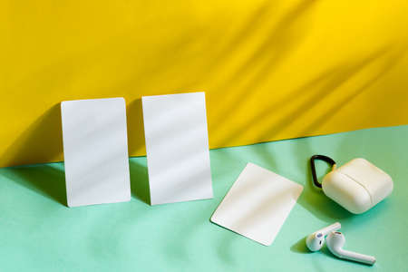 blank business cards on duotone background with shadows, good for texte and logoの写真素材