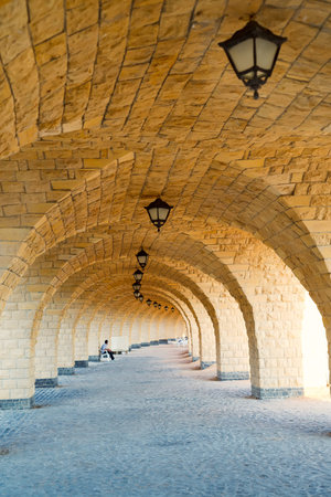 Architectural perspective from arched corridor.
