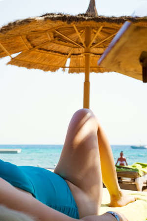 Young woman is relax taking sunbaths.の写真素材