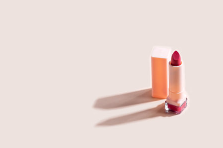 red lipstick on beige background with copy space. Fashion blog design.の写真素材