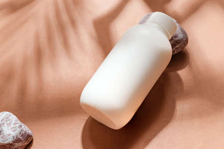 Close-up mockup bottle on papaya background.の写真素材