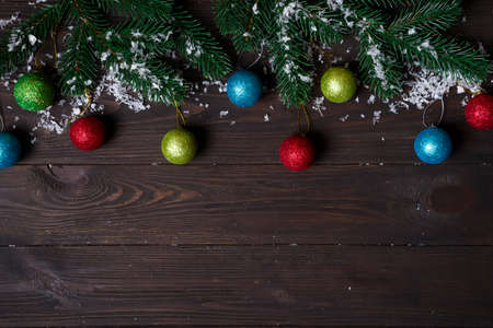 Christmas wooden background with snow fir tree.の写真素材