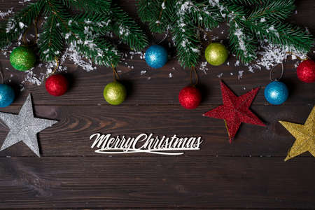 Christmas wooden background with snow fir tree.の写真素材