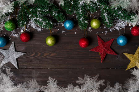 Christmas wooden background with snow fir tree.の写真素材