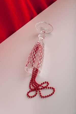 Holiday still life party themed image with glass and decorations.の写真素材