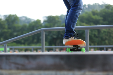 skateboarding legs at skateparkの写真素材
