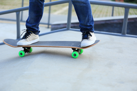 skateboarding legs at skateparkの写真素材