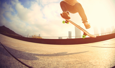 skateboarder skateboarding at  cityの写真素材