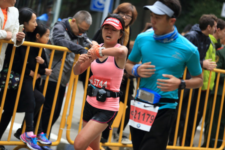 SHANGHAI,CHINA - NOVEMBER 08:Marathon runners running on city road at the 20th Shanghai Marathon NOVEMBER 08,2015 in Shanghai,Chinaのeditorial素材
