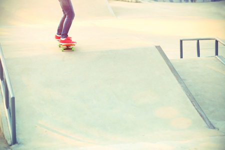 skateboarding legs at skateparkの写真素材