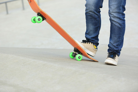 skateboarding legs at skateparkの写真素材