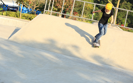 skateboarding woman at skateparkの写真素材