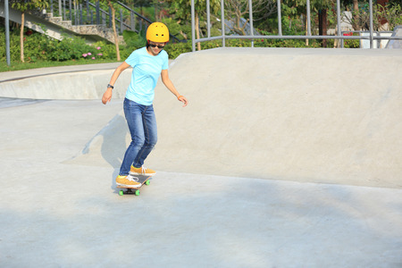 skateboarding woman at skateparkの写真素材