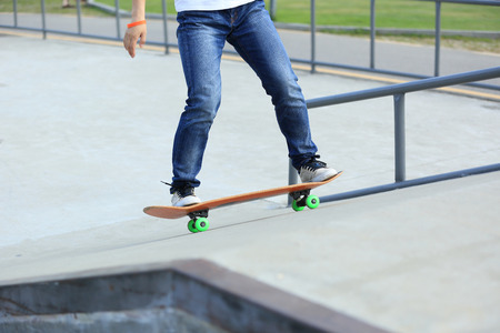 skateboarding legs at skateparkの写真素材