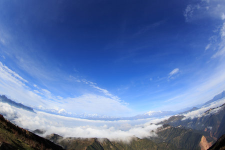 beautiful rolling clouds and snow mountain landscape