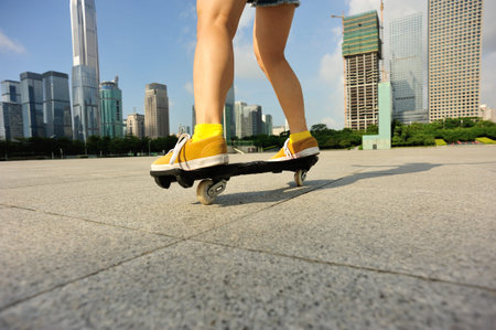 young woman legs riding on ripstick