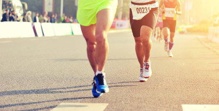 Marathon running race, people feet on city road
