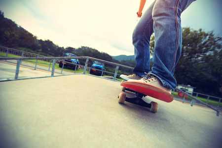skateboarder legs skateboarding at skatepark rampの写真素材