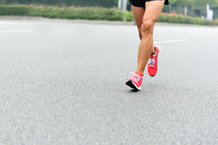 Marathon running race, people on city road