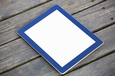 digital tablet on wooden deckの写真素材