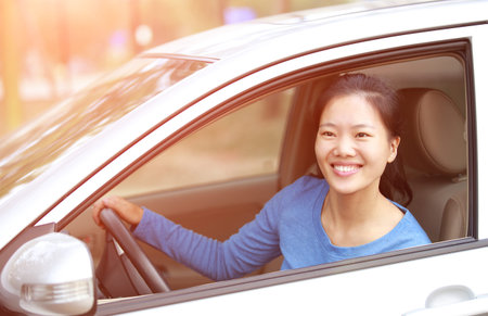 happy woman driver sit in car
