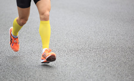 marathon runner running on city road