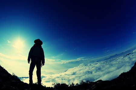 successful woman hiker enjoy the view mountain peakの写真素材