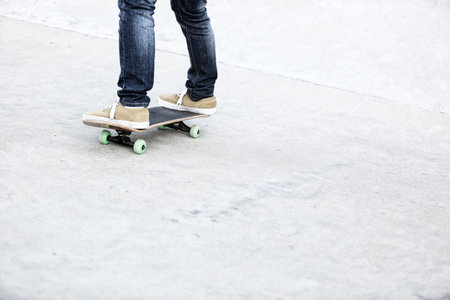 skateboarding woman legs at skatepark