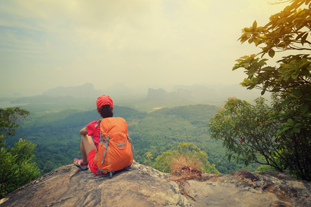 successful woman hiker enjoy the view on mountain topの写真素材