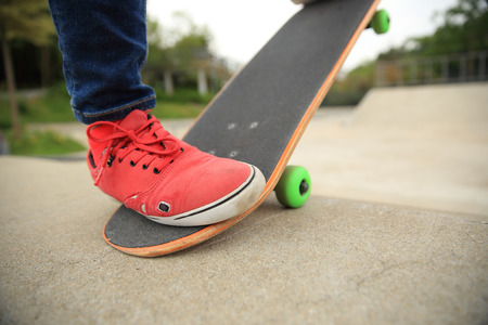 skateboarding legs at skatepark rampの写真素材