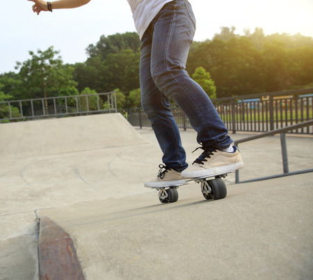 freeline skateboarder legs riding on freeline at skateparkの写真素材