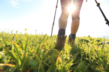successful woman backpacker enjoy the view on sunrise mountain peakの写真素材