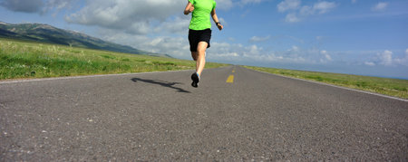 healthy lifestyle young fitness woman runner running on road