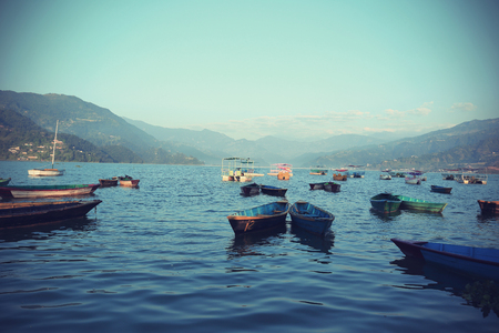 Colorful boats in Phewa Lake in Pokhara, Nepalのeditorial素材