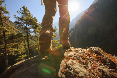 young woman hiker enjoy the view on sunrise himalaya mountainsの写真素材