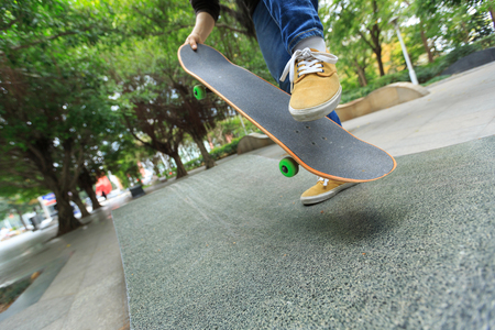 skateboarder legs skateboarding at skateparkの写真素材