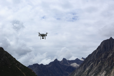 flying drone with the camera in the skyの写真素材