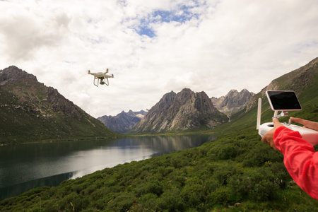 asian woman photographer flying drone outdoors
