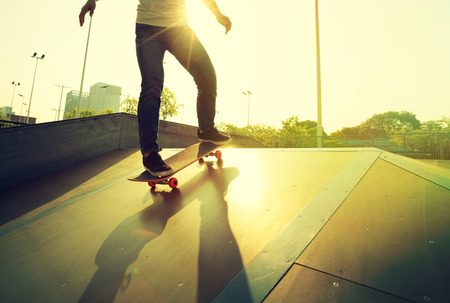 skateboarder legs skateboarding on skatepark rampの写真素材