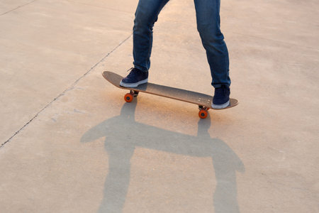 skateboarder legs skateboarding on skatepark
