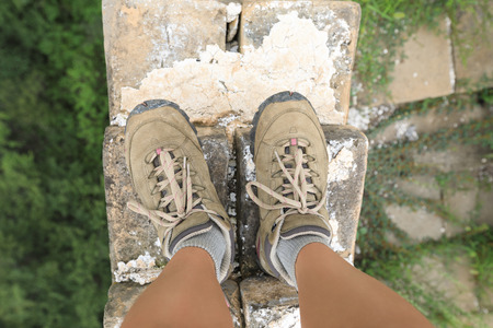 successful  hiker legs on the top of great wallの写真素材