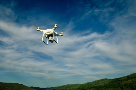 drone flying in the air over forest
