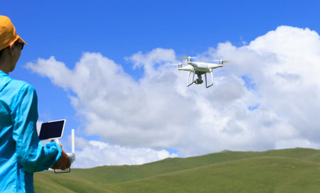 woman photographer flying drone outdoors