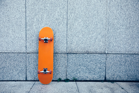 one skateboard against wallの写真素材