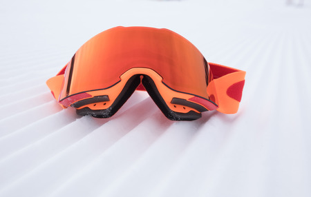 snowboard goggles on ski piste slopの写真素材