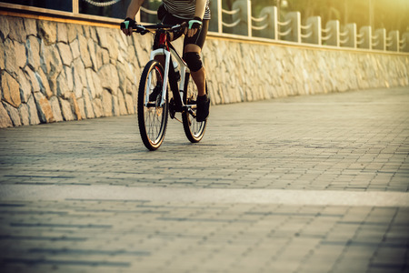 cyclist riding mountain bike in the coast trailの写真素材
