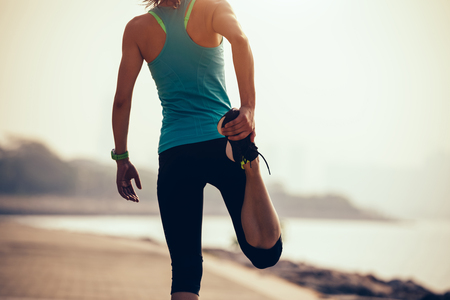 fitness sportswoman warmup on coastの写真素材