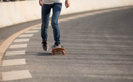 Skateboarder sakteboarding on highwayの写真素材