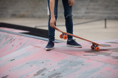 Skateboarder sakteboarding on skatepark ramp