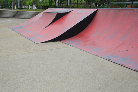 Skateboard leaning on skatepark ramp